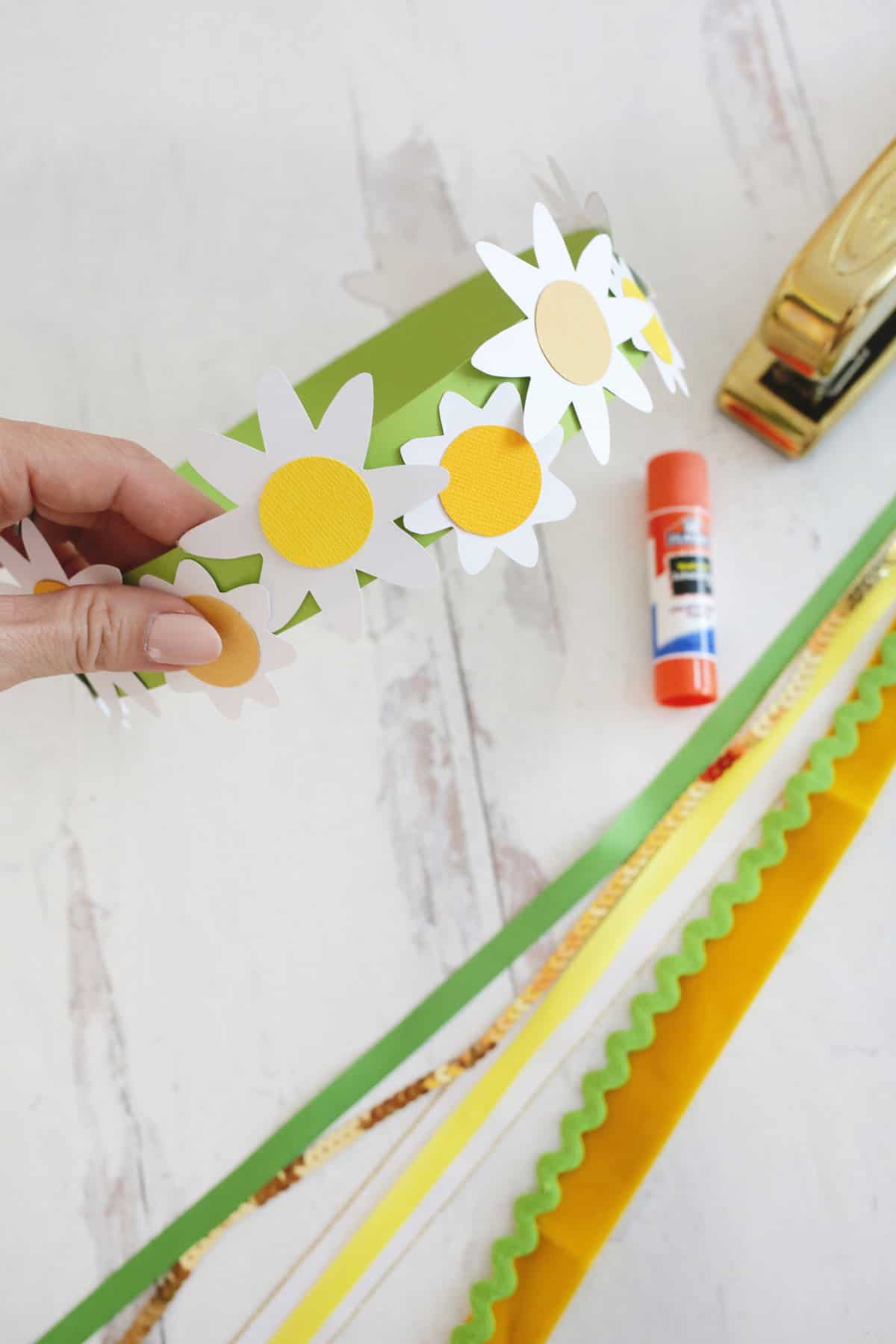 paper daisies glued to paper crown