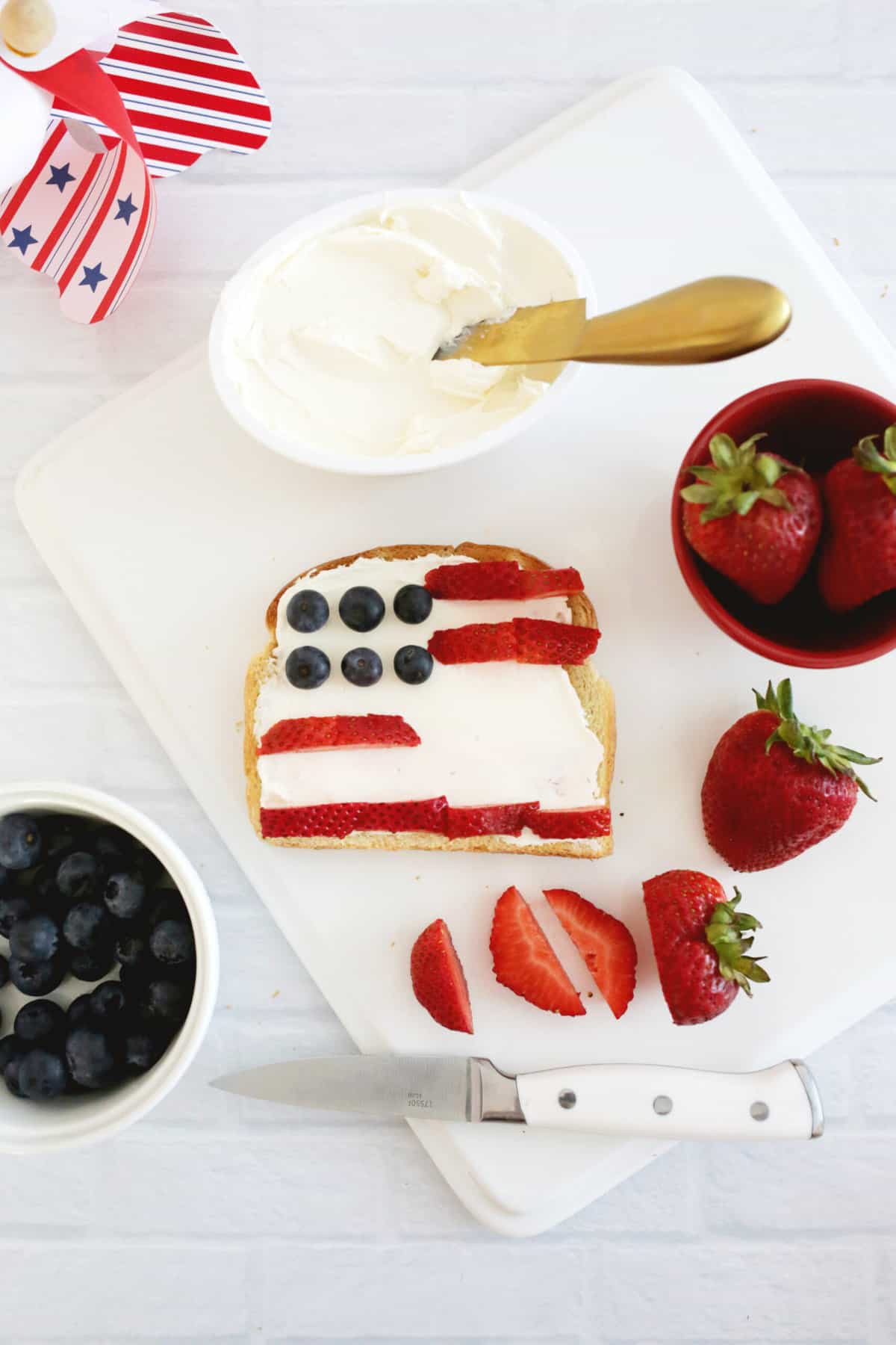 adding strawberry stripes to american flag toast