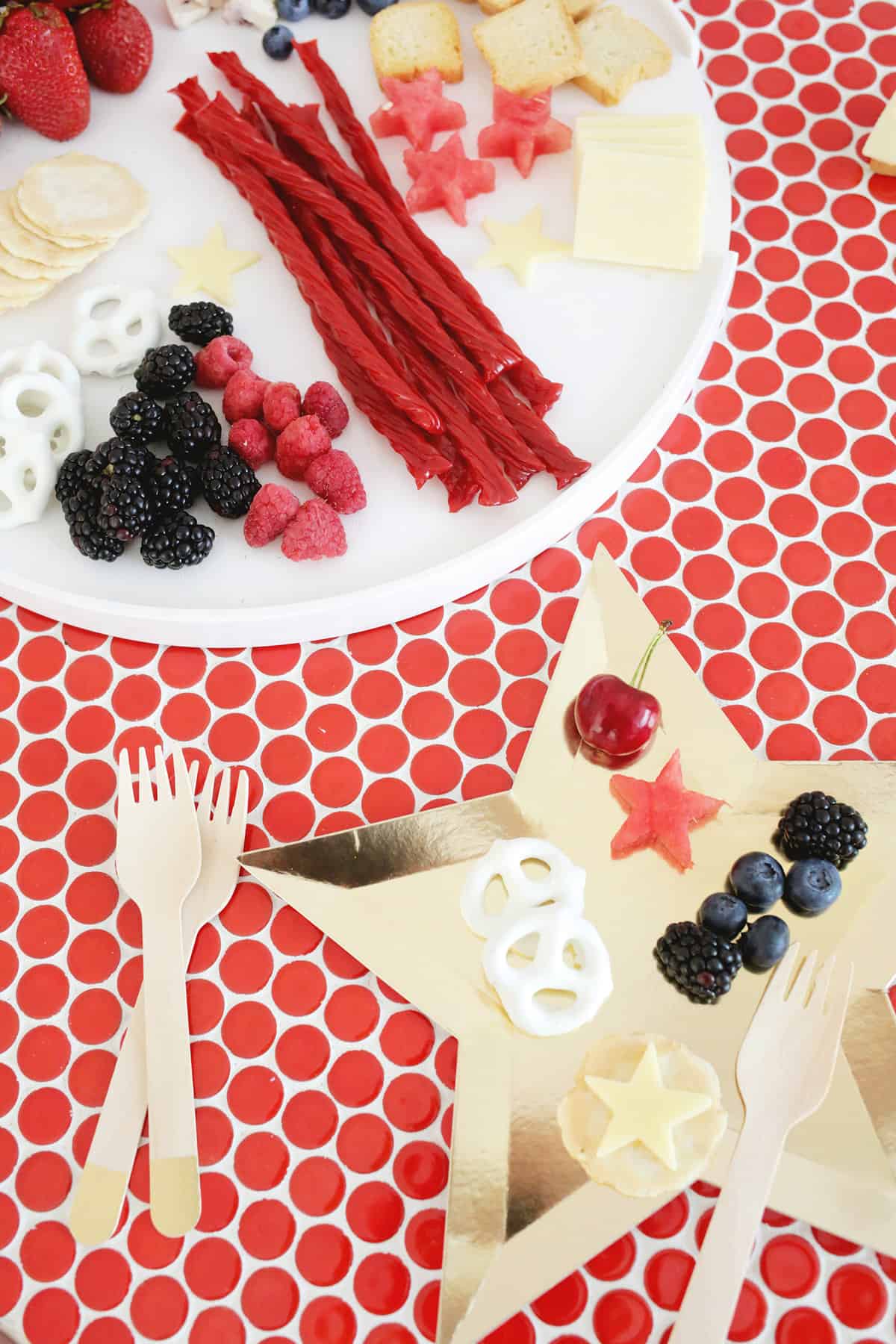 cheese and fruit board with red, white, and blue foods and a star plate