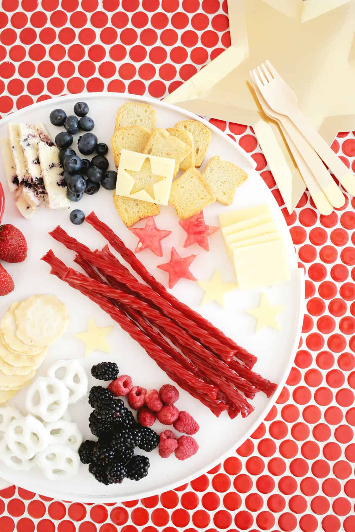 cheese and fruit board with red, white, and blue foods