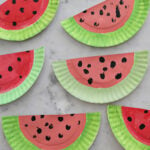 Paper plates painted to look like watermelons.