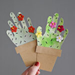 handprint cactus paper craft being held.