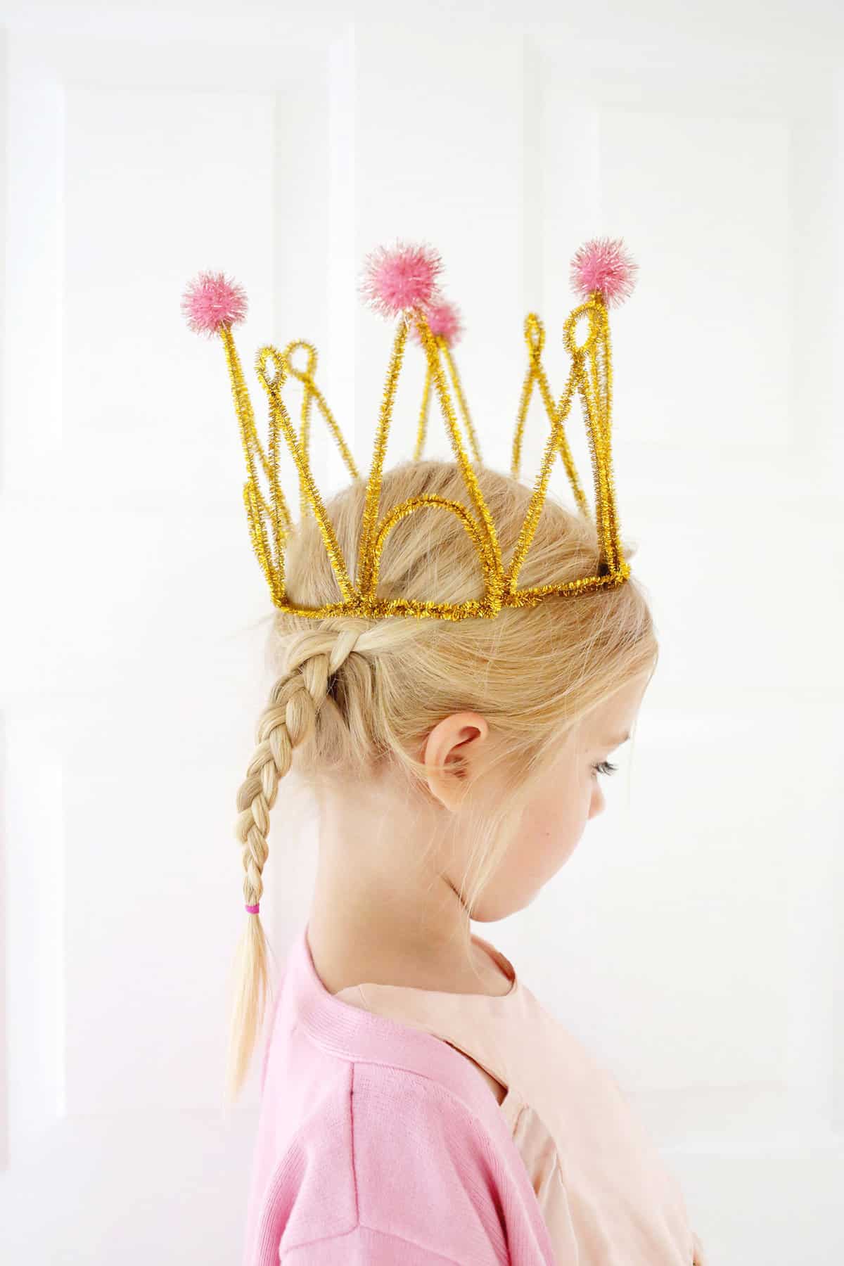 girl wearing pipe cleaner crown