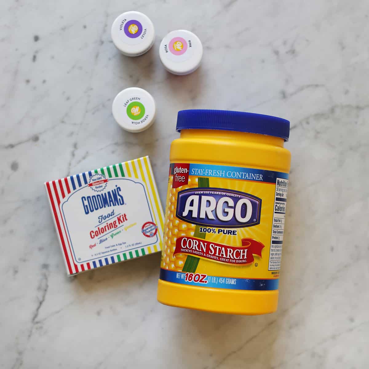 corn starch and food coloring on counter. 