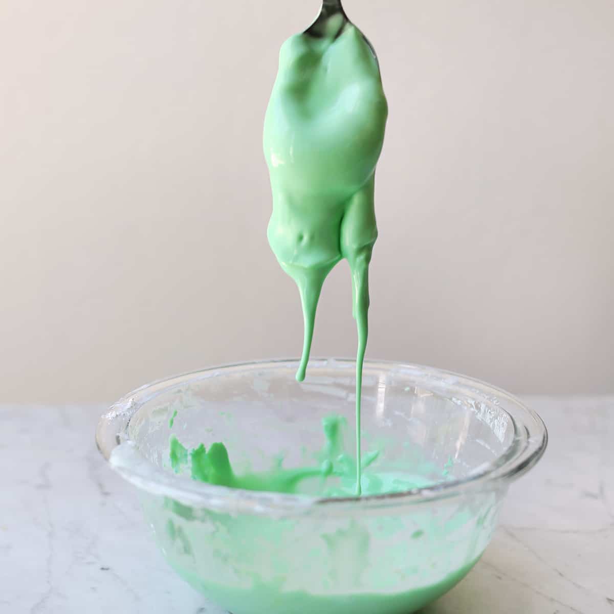 Oobleck dripping into a bowl. 
