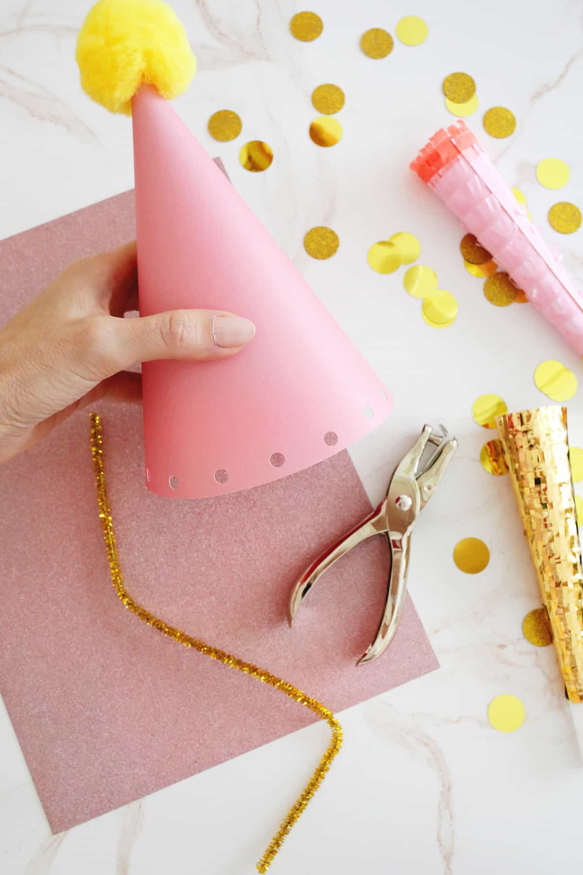 holes punched in edge of party hat