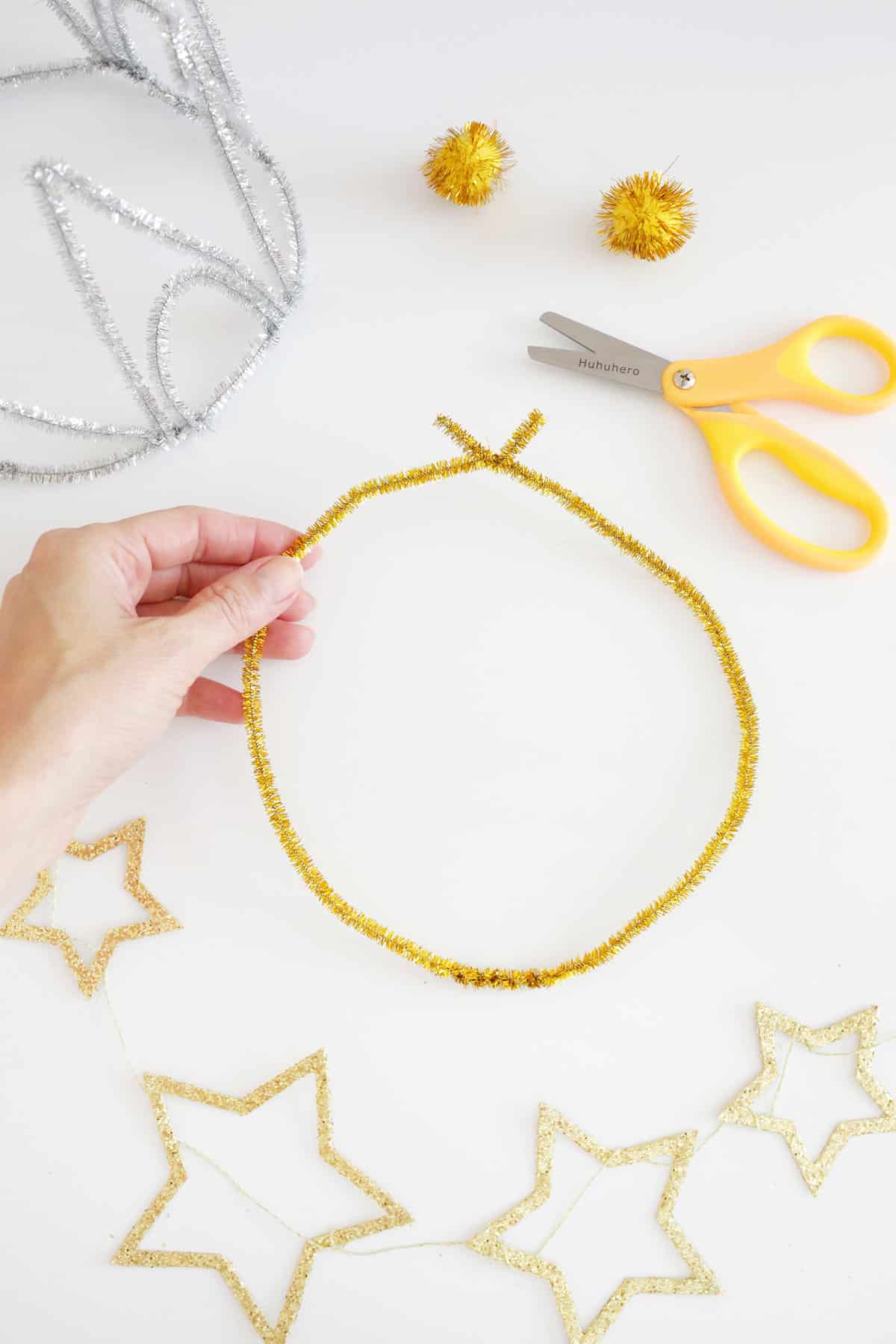 twisting a pipe cleaner into a crown