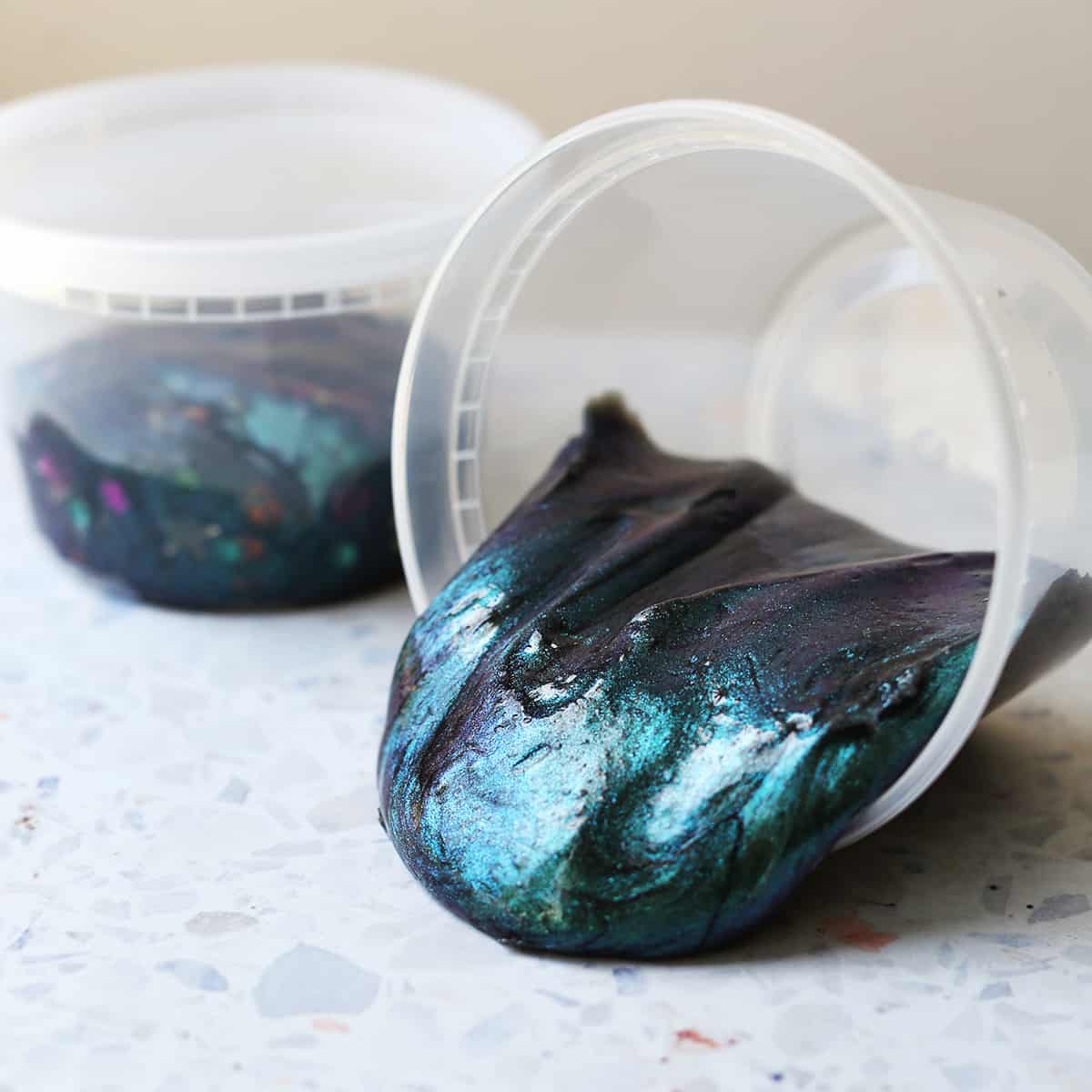 clean containers with galaxy slime spilling out. 