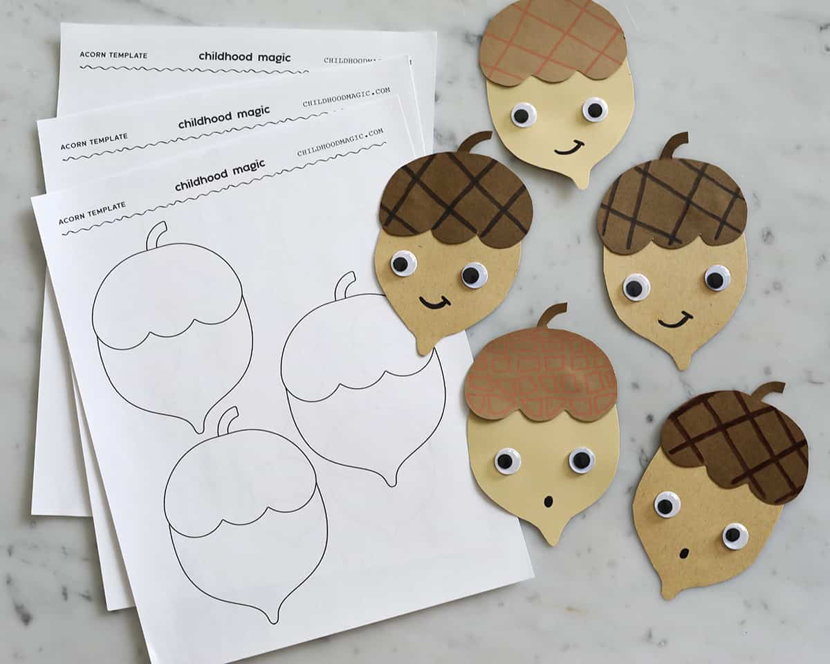 acorn template on printer paper and acorns made from cut out construction paper.