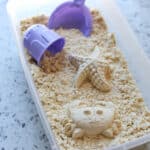 DIY moon sand in a box with toys