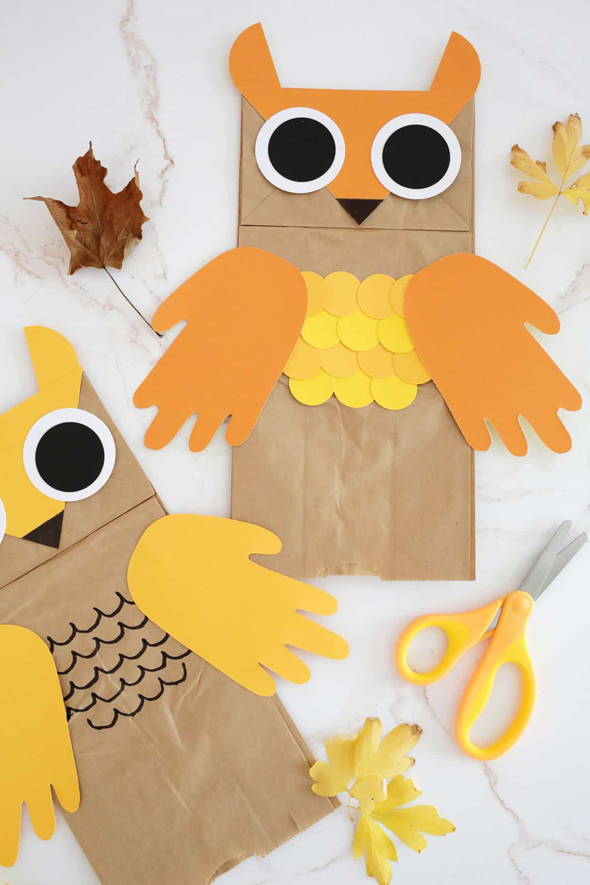 Brown paper lunch bags made into owl puppets. 