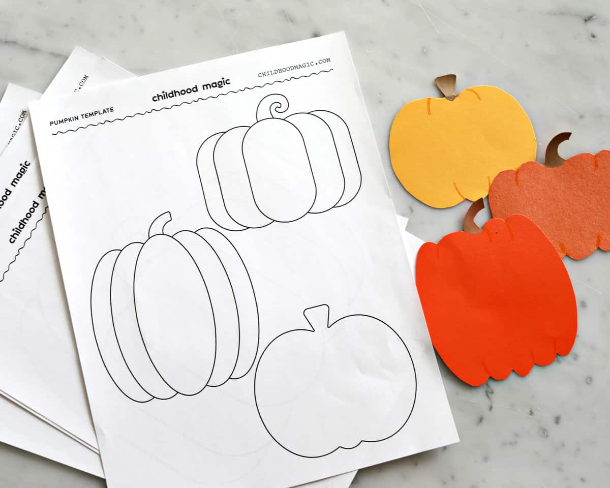 pumpkin outline printouts next to pumpkins that have been cut out.