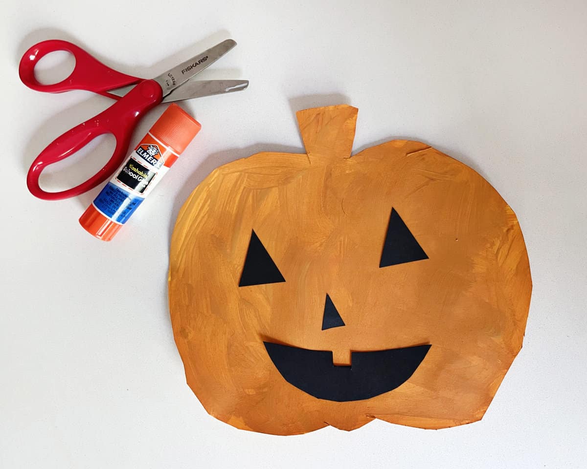 Crafted paper pumpkin cut out and decorate for Halloween.