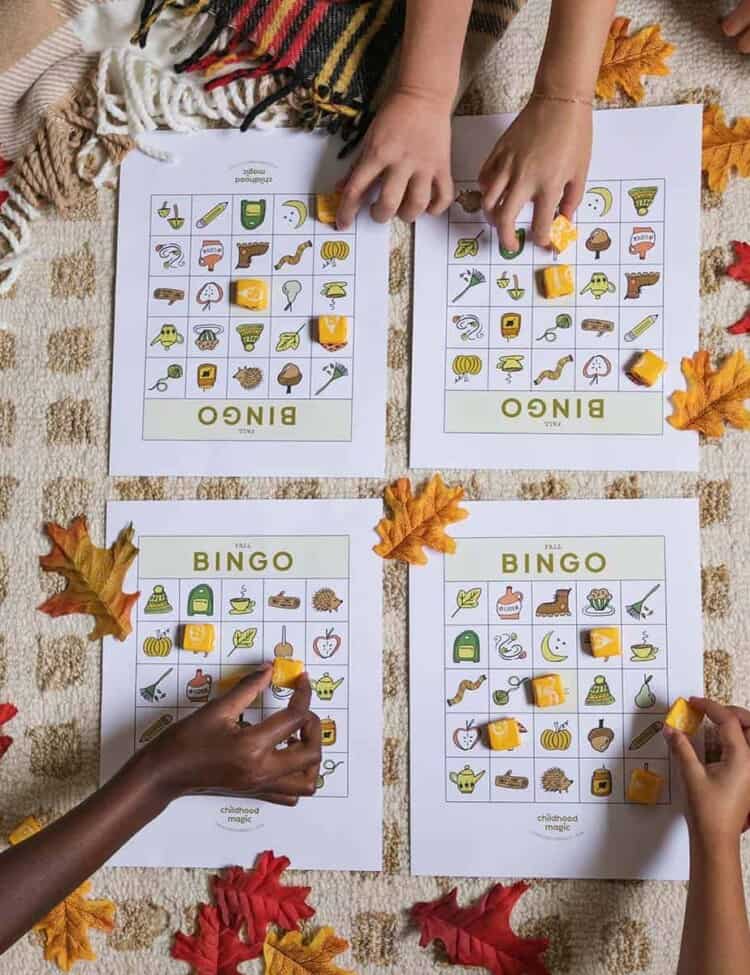 children playing bingo on a table.