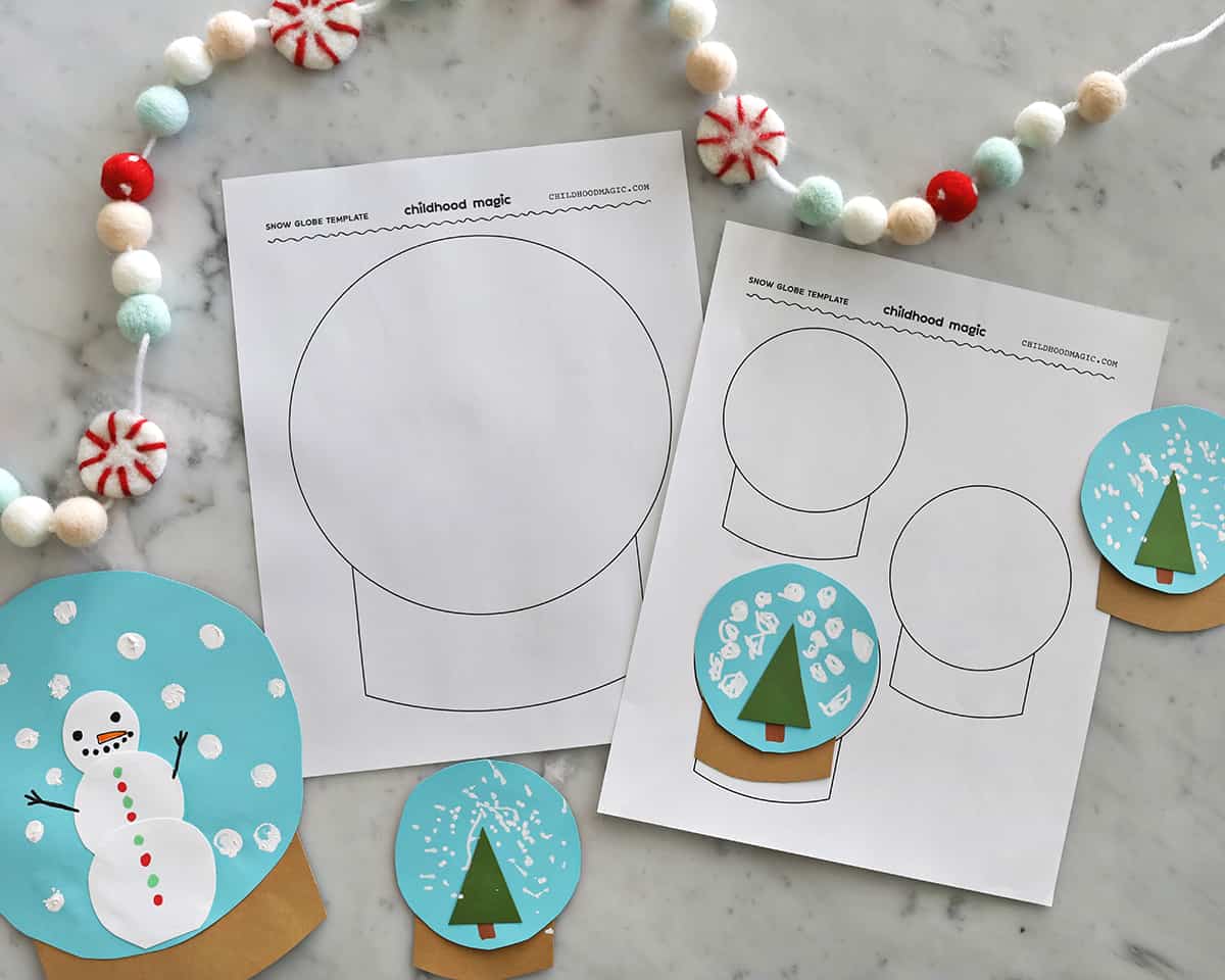 Snow globe printed template and crafted snow globes with blue, brown and green construction paper. 