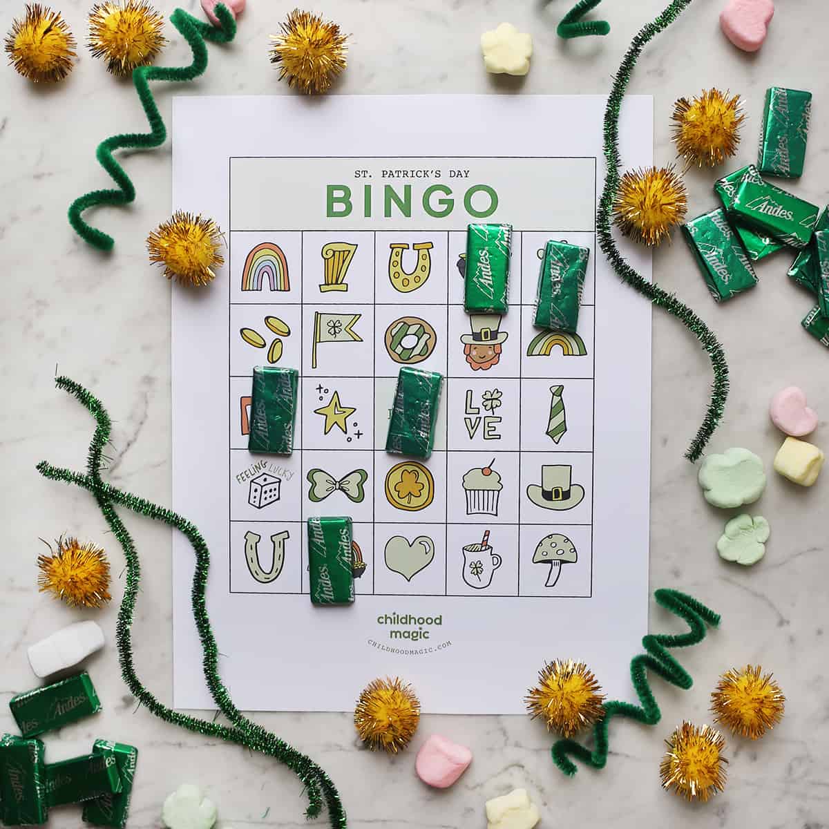 St. Patrick's Day bingo card on counter with candy for tokens. 
