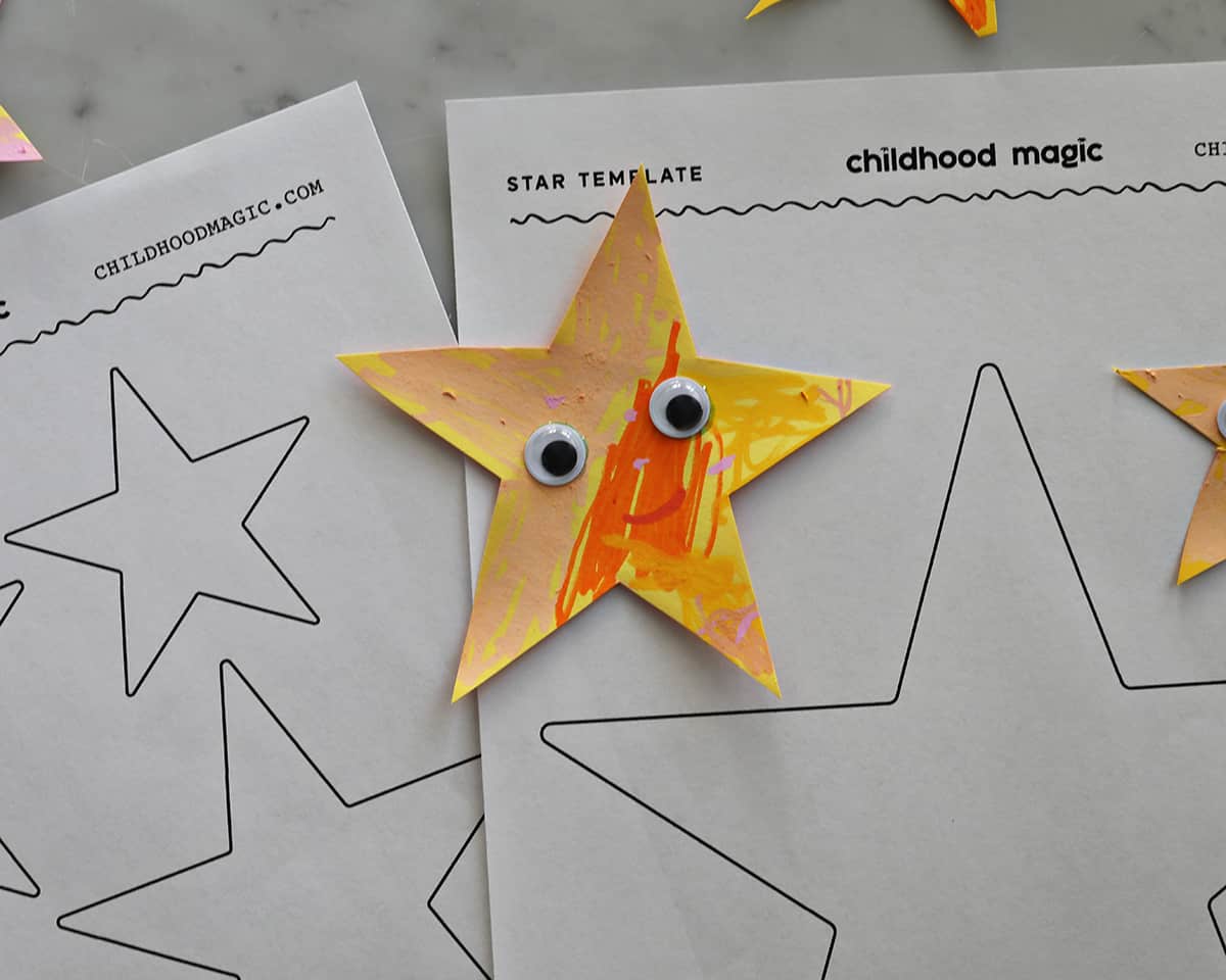 A paper star that has been cut out and painted, and then had googley eyes added to it.  