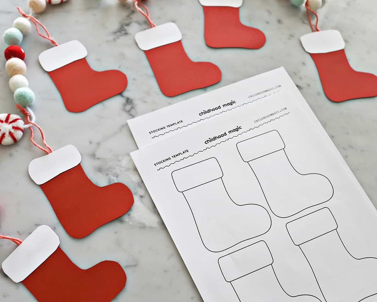 Christmas stockings cut out of construction paper and printer paper with stocking designs. 