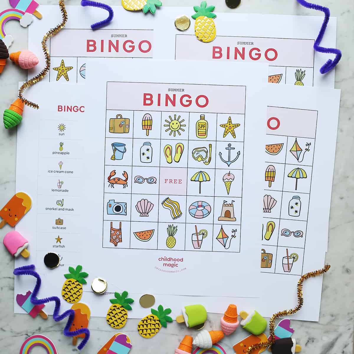 summer-themed bingo cards on table.