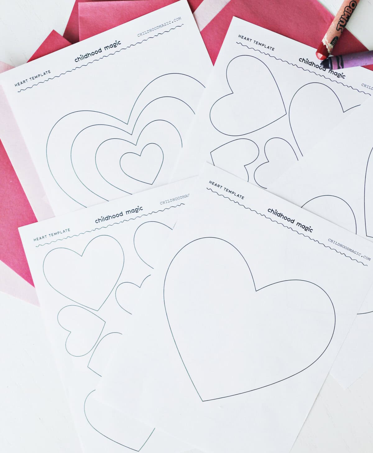 heart outlines in black on white pieces of paper. 