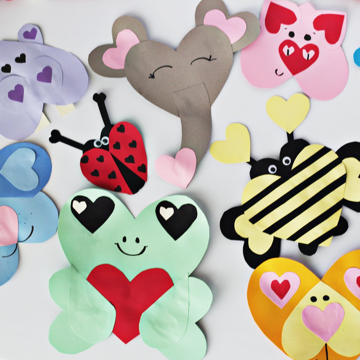 Various colors of cardstock used to make animals out of heart shapes. 