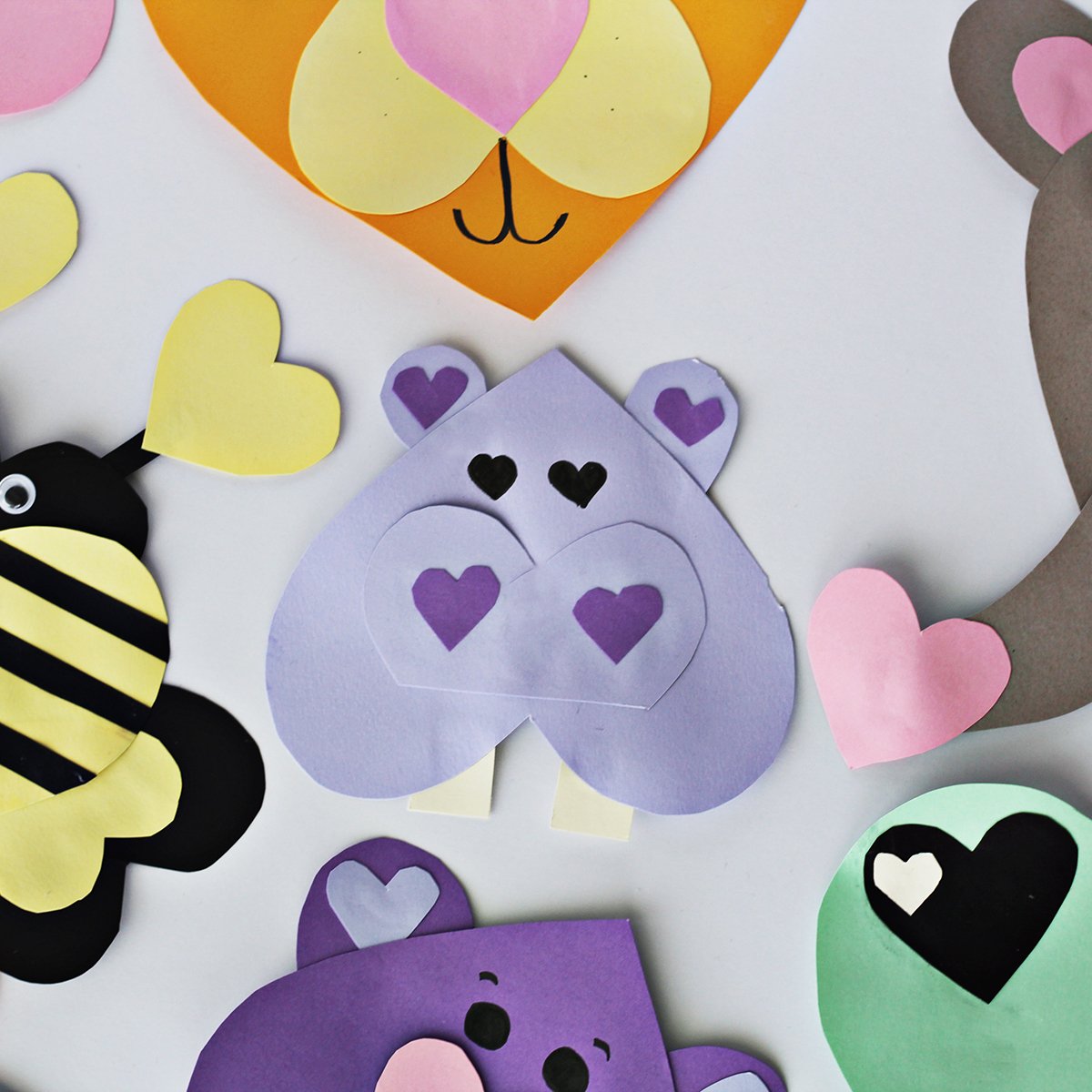 Light purple paper cut into hearts and glued together to make a hippo. 