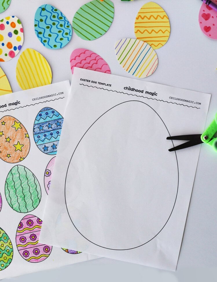 An outline of a large Easter egg on a white background next to a pair of green kids scissors and a coloring page with smaller eggs on it.