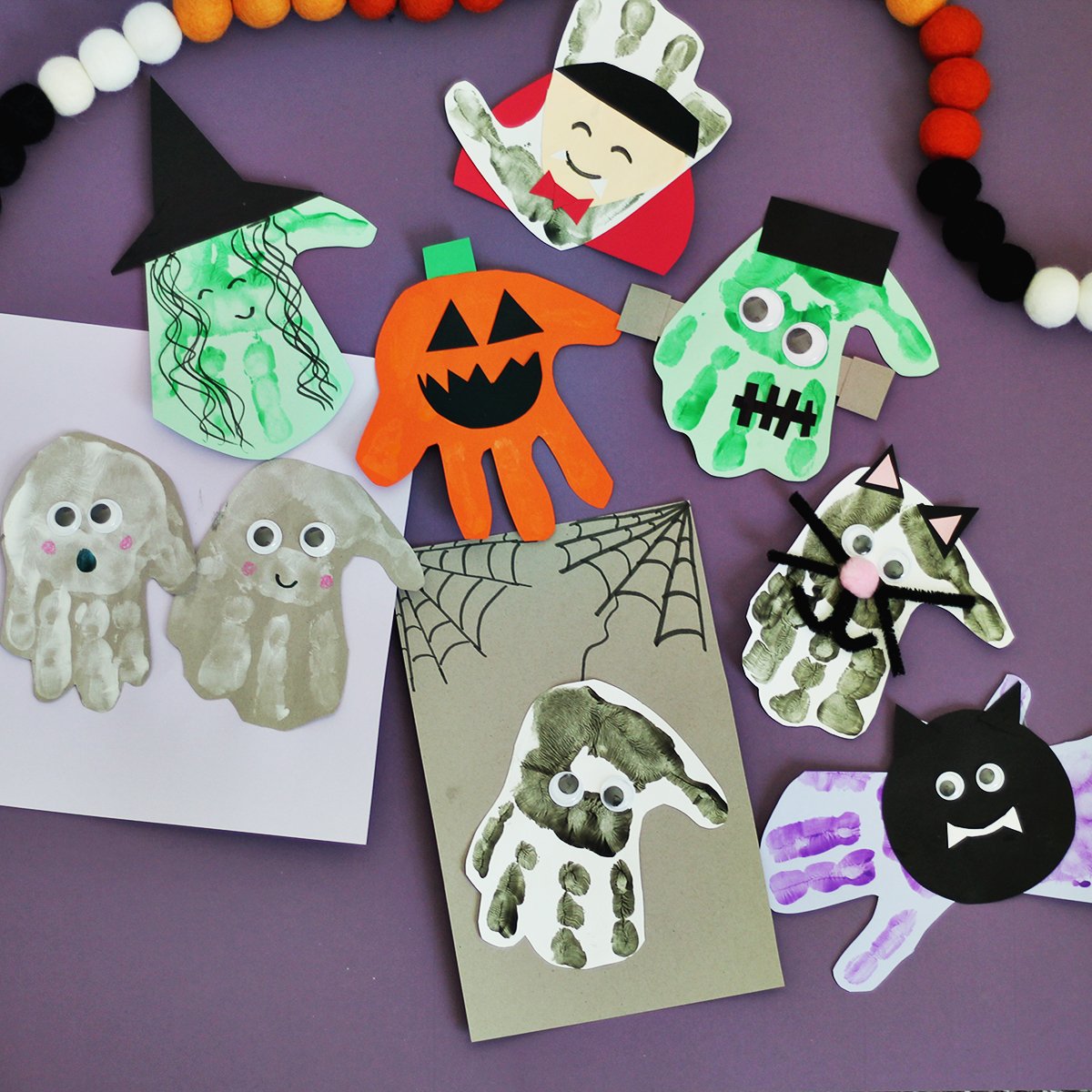 Handprints on paper made into Halloween crafts.