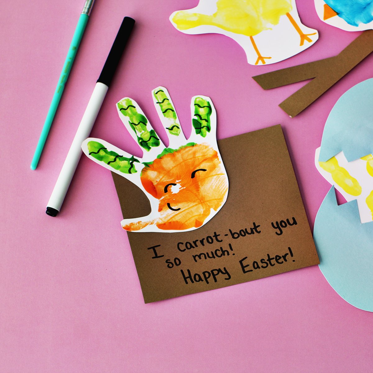 Orange and green handprint made to look like a carrot for a Spring handprint card.