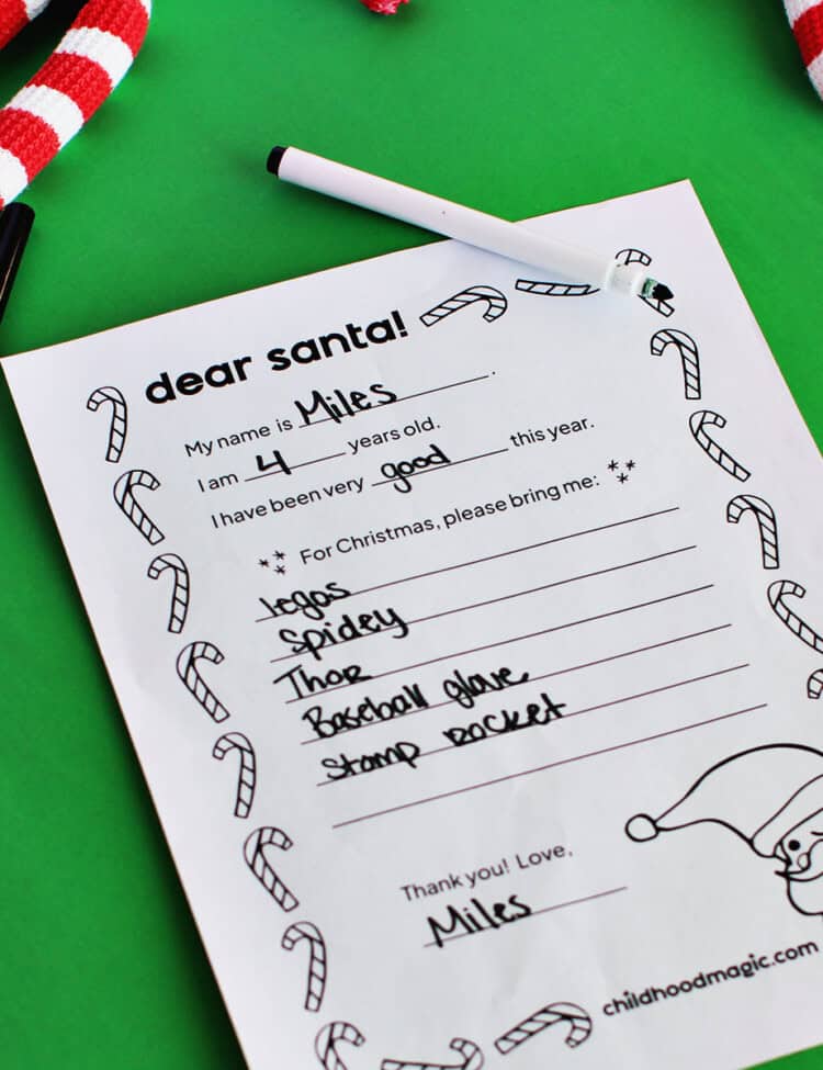 Letter to Santa template on a green background surrounded by a candy cane garland.