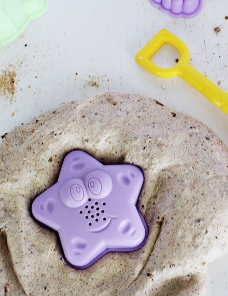 Sand slime with a starfish sand toy.