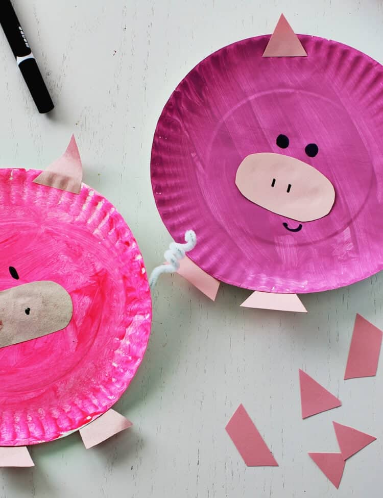 Pink paper plate painted and decorated to look like a pig.