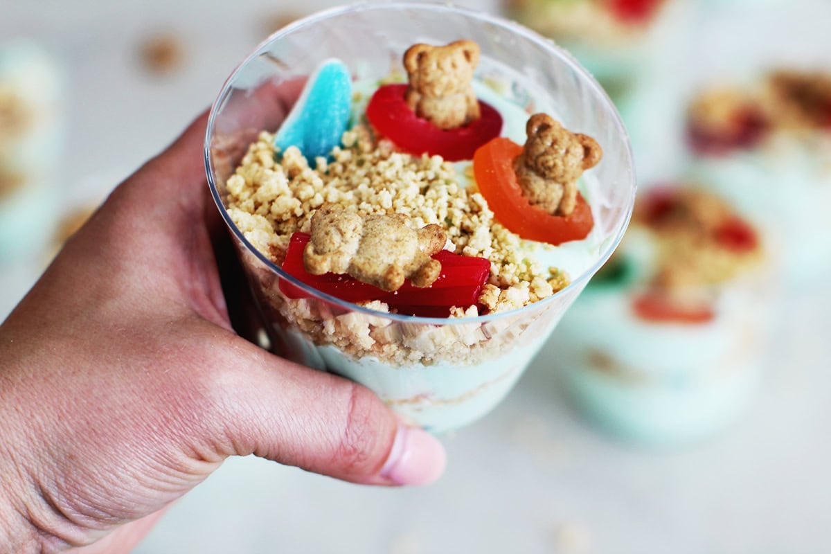 Blue instant pudding with crushed up golden oreos and gummies in it.