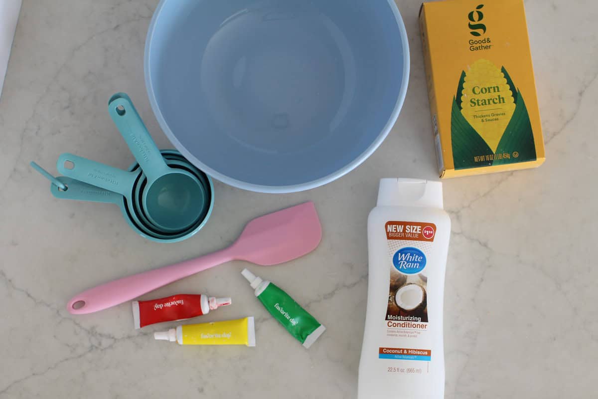 Ingredients and supplies to make cloud dough.
