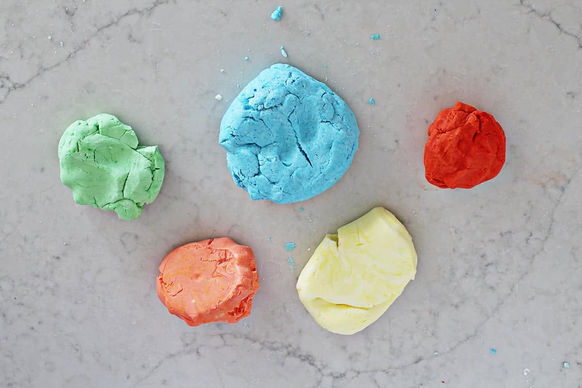Green, blue, red, orange and yellow cloud dough.