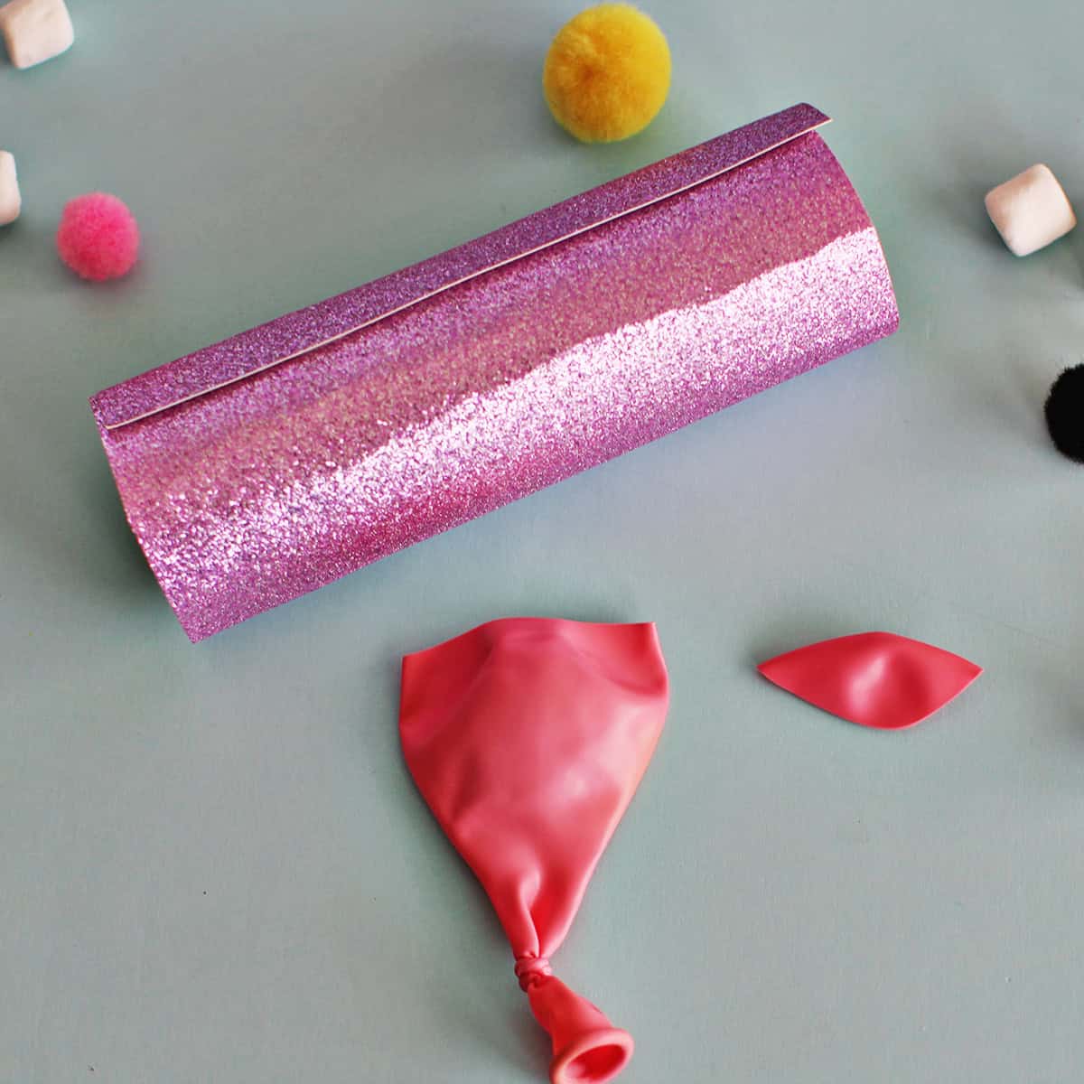 Cut top off of balloon.