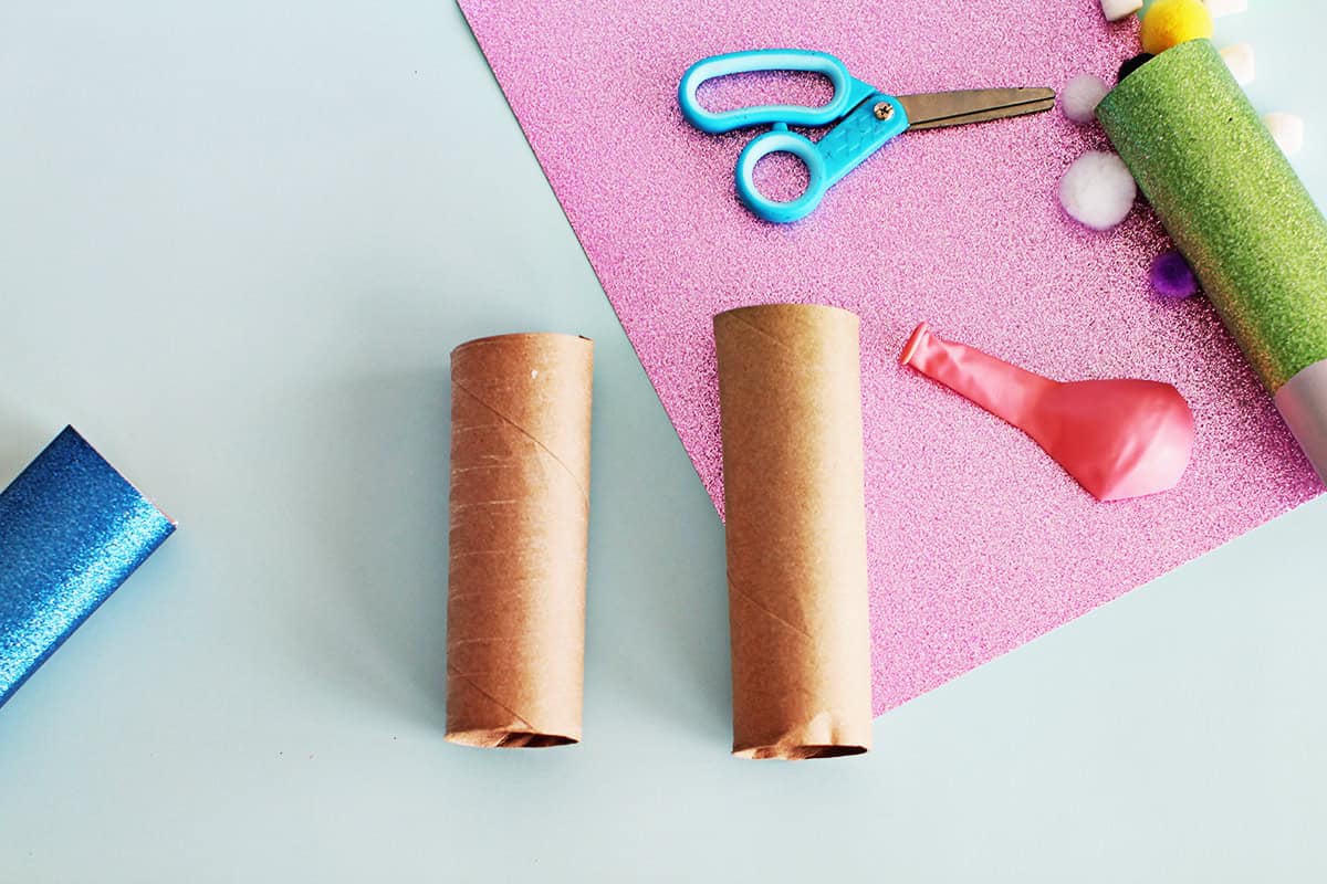 Cut paper towel roll in half.