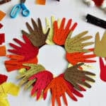 Fall handprint wreath made from a paper plate.
