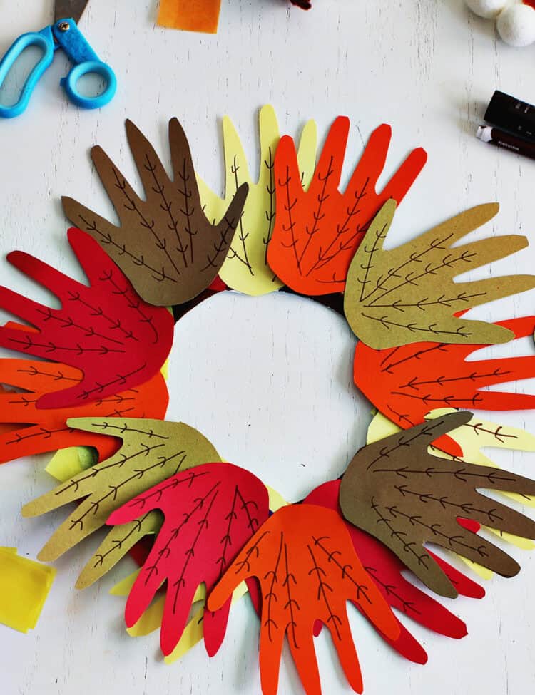 Fall handprint wreath made from a paper plate.
