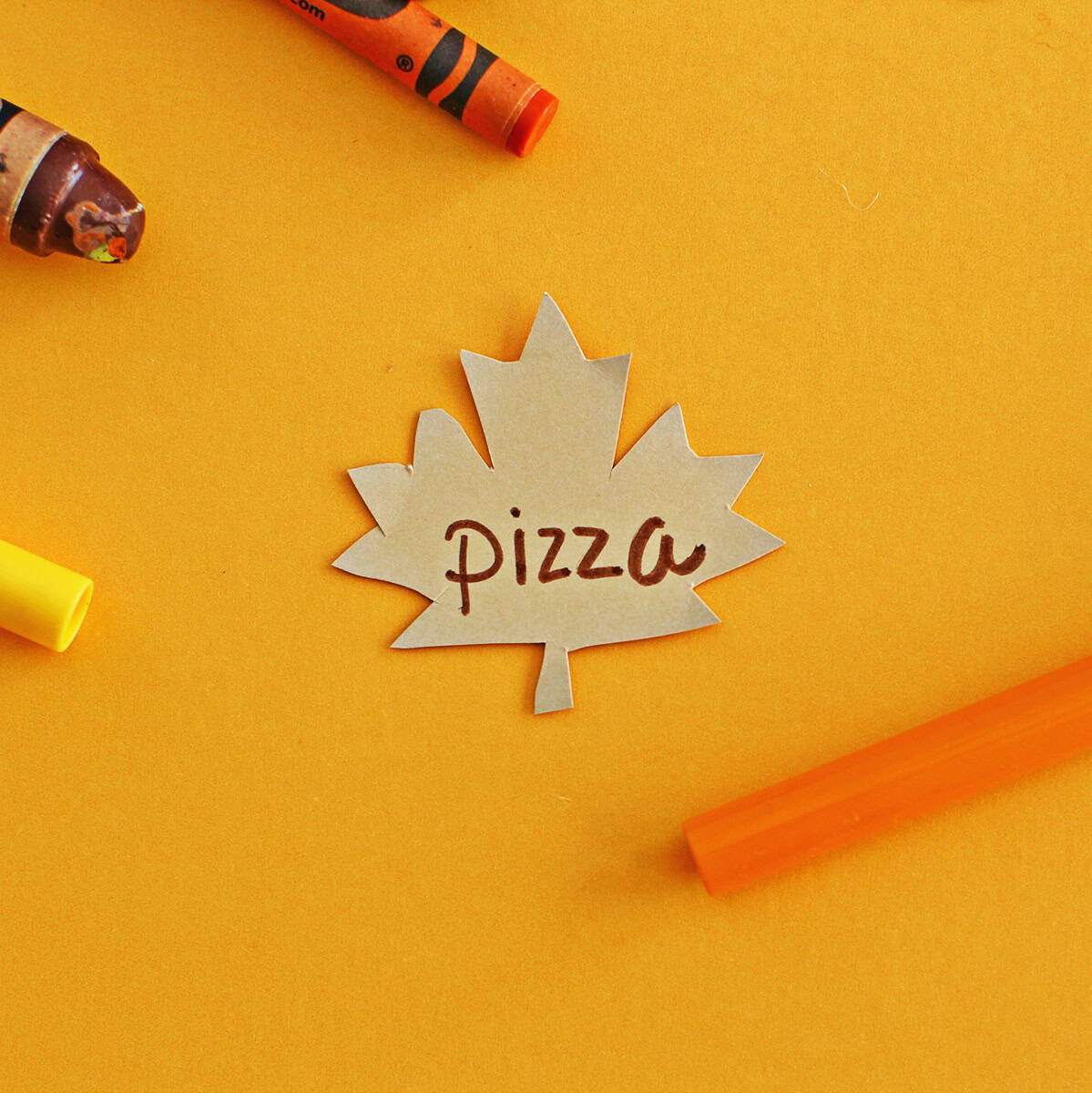 Cut out leaf with pizza written on it for thankful tree craft.