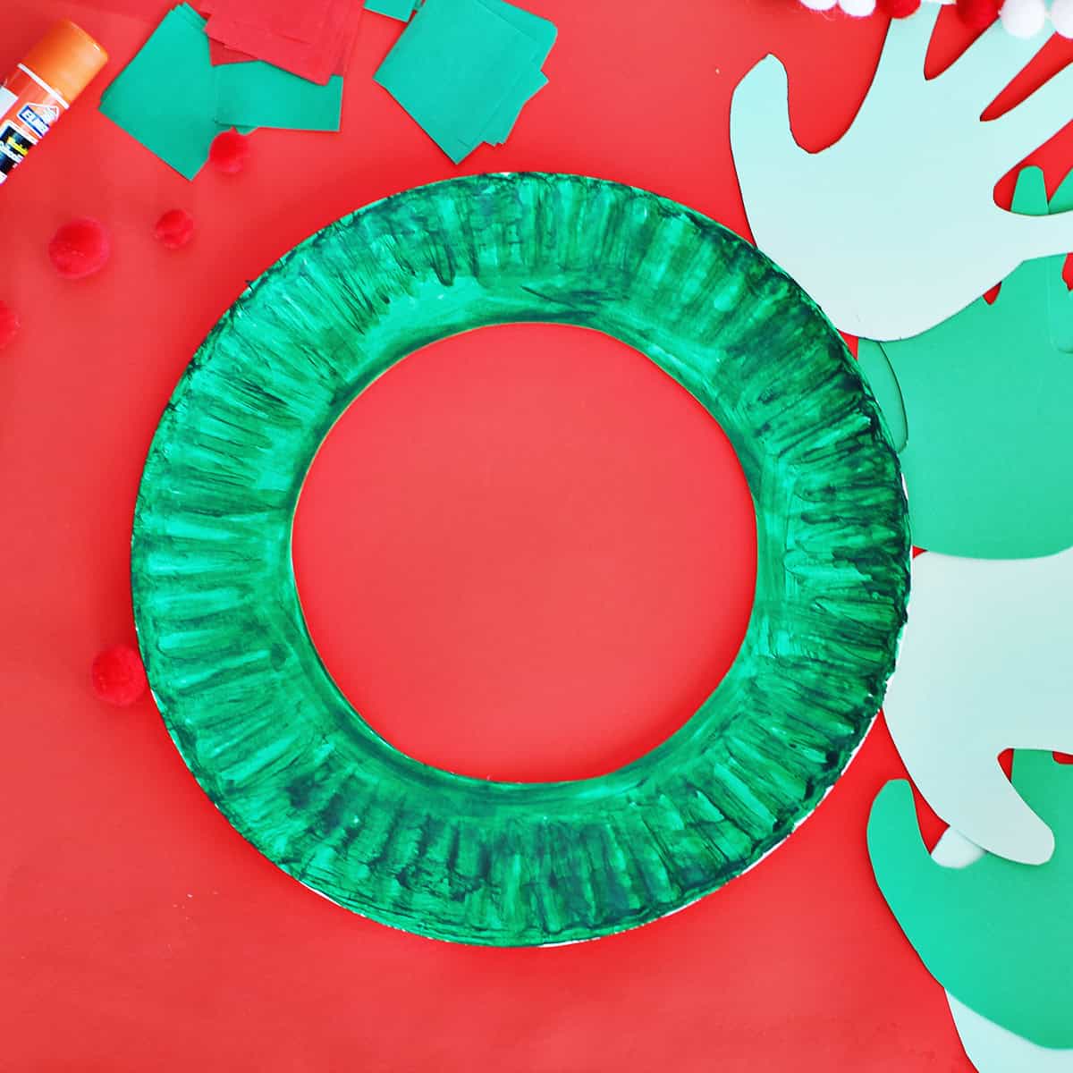 paper plate painted green to make a wreath.