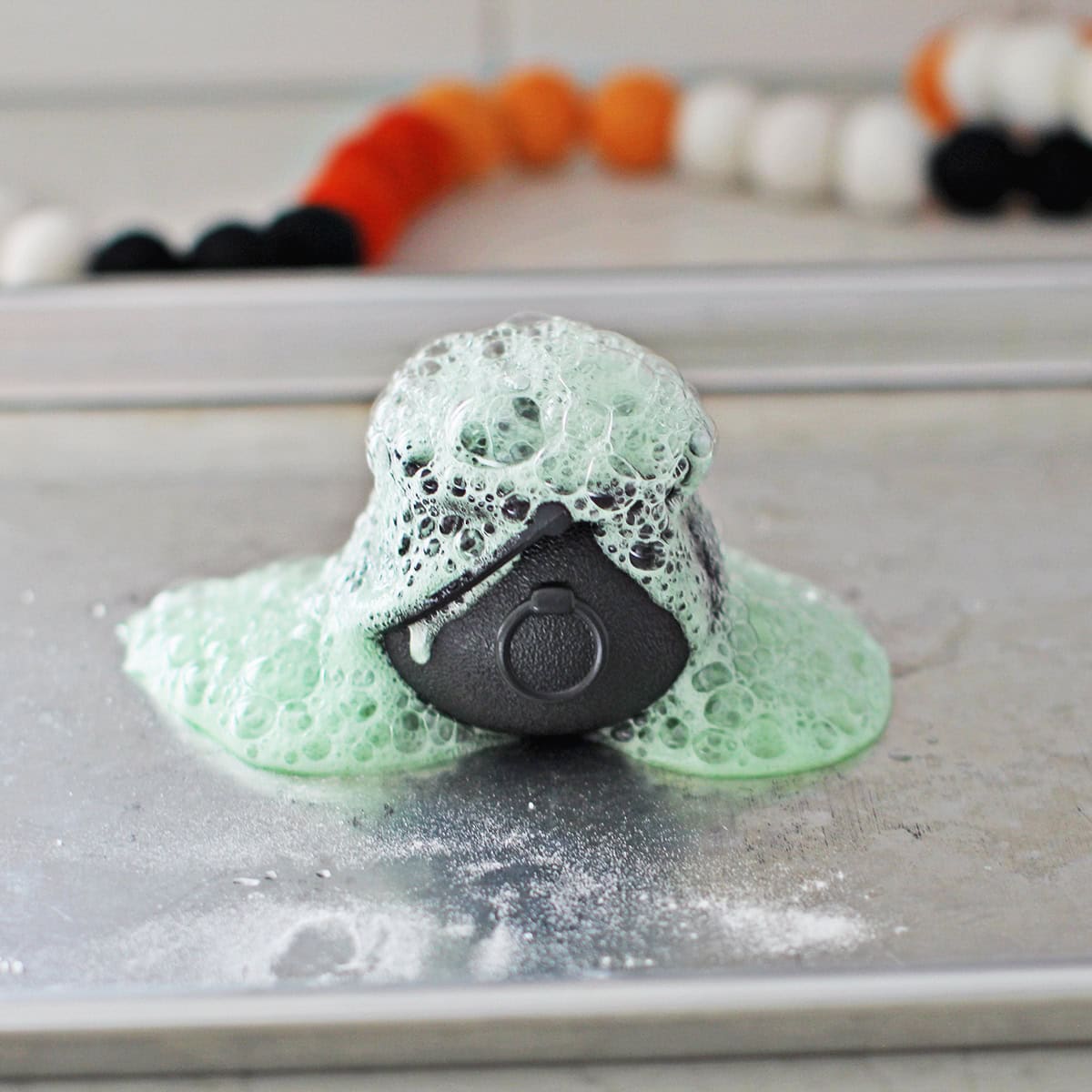 Fizzy potion experiment for kids using baking soda and vinegar.