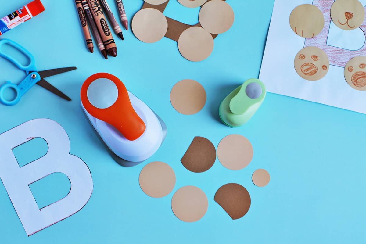 hole punch used to make circles for bear paper craft.