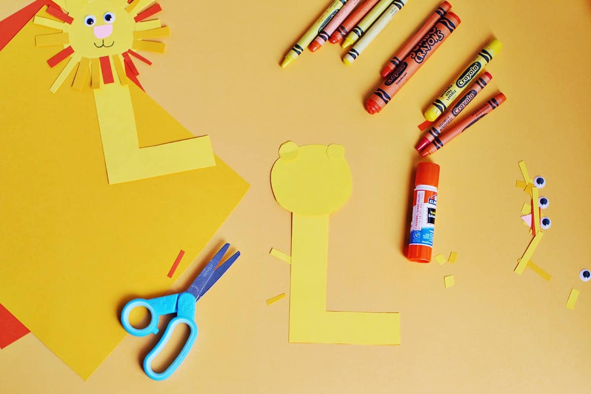 yellow cardstock glued onto a cut out 'L' to make a lion head.