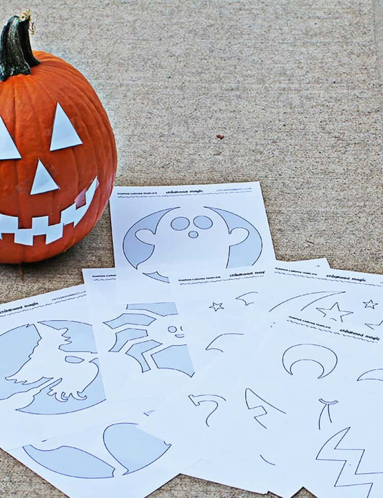 printable pumpkin carving templates on the ground next to a pumpkin about to be carved.