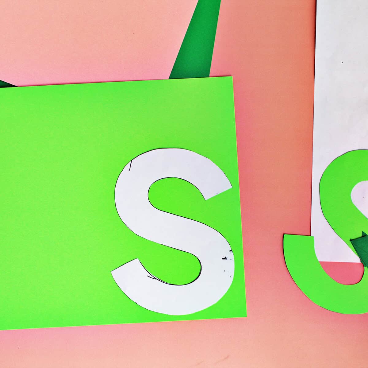 S template on a lime green piece of cardstock.