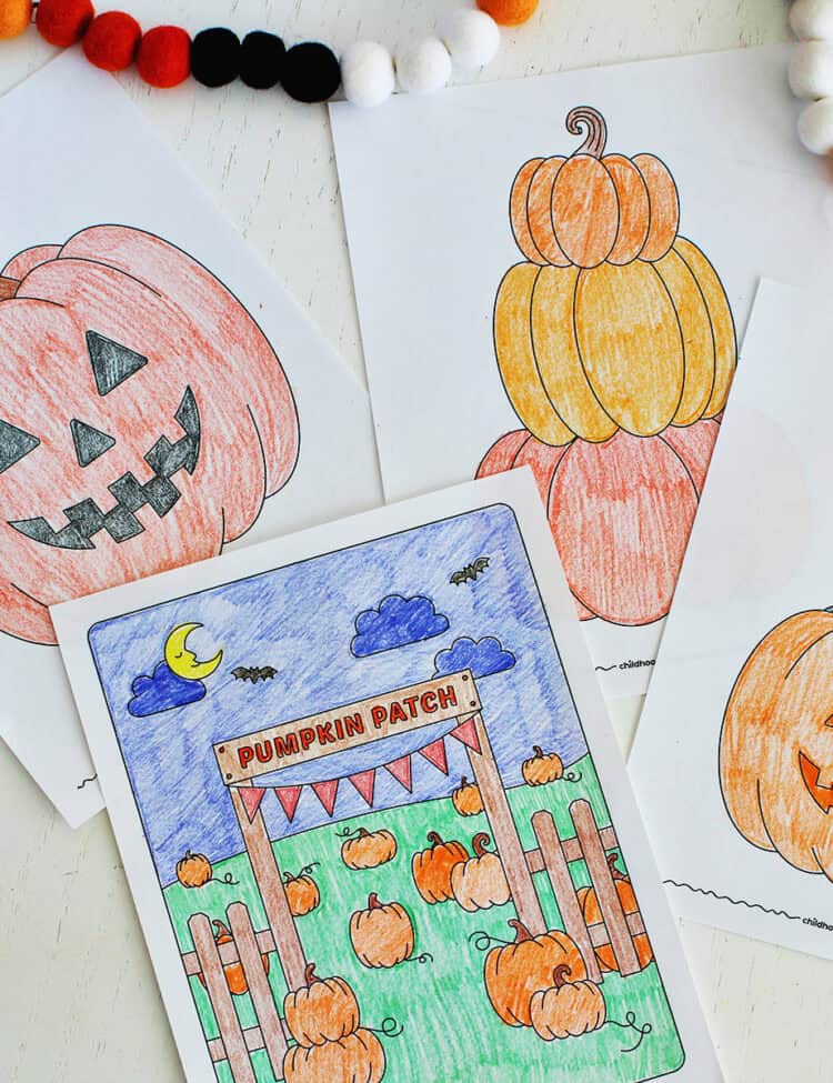 printable pumpkin themed coloring pages that have been colored with crayons.