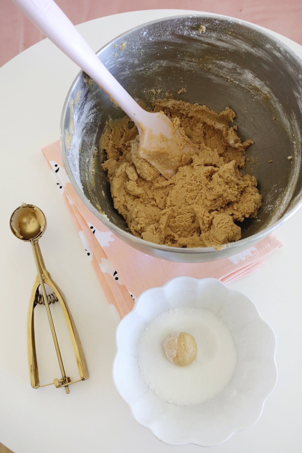 making dough balls for peanut butter cup spider cookies