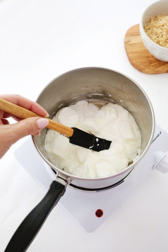 melting butter and marshmallows for rainbow rice krispies treats