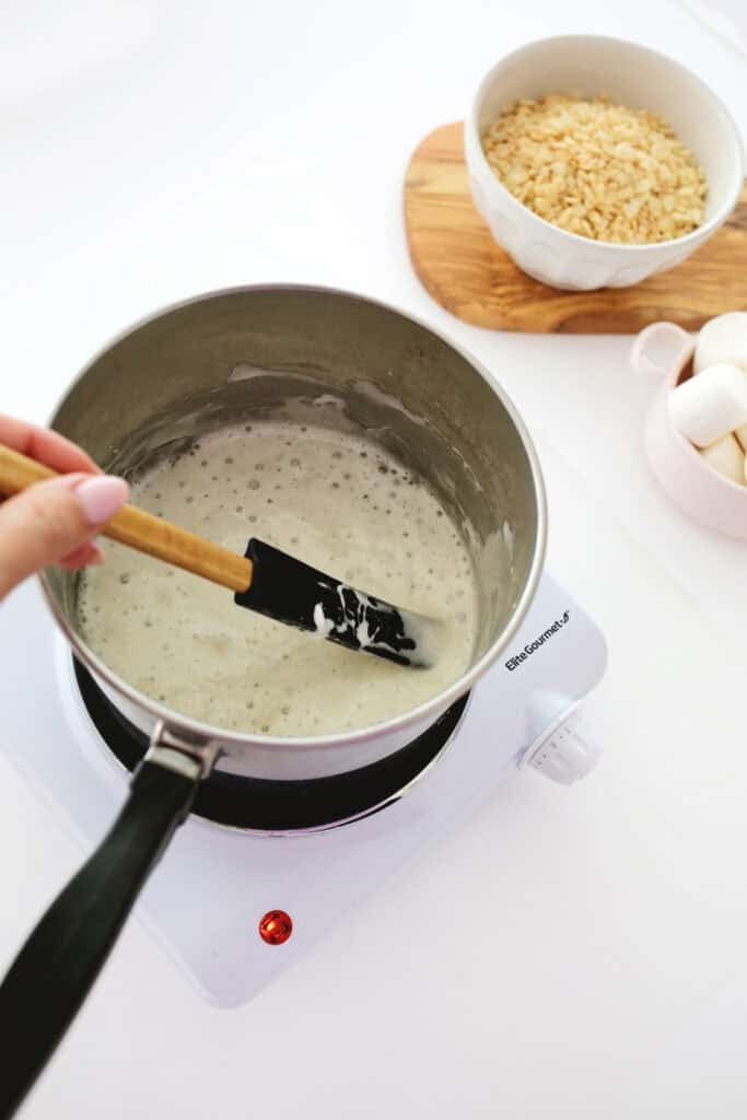 melting butter and marshmallows for rainbow rice krispies treats